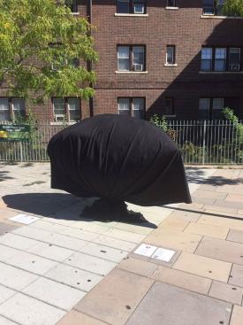 Sleeping Moon in mourning shroud: The signature sculpture outside Ashmont will remain covered until Oct. 15.